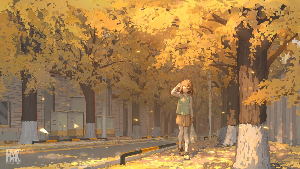 一位少女走在银杏飘落的大街上